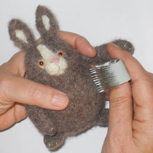 Load image into Gallery viewer, rabbit being brushed with a nap riser brush, marie mayhew