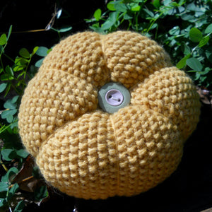 seed stitch pumpkin pattern, bottom of pumpkin showing the button blossom end, marie mayhew designs