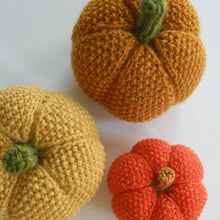 Load image into Gallery viewer, seed stitch pumpkin pattern, showing two sizes, worsted and fingering weight yarns